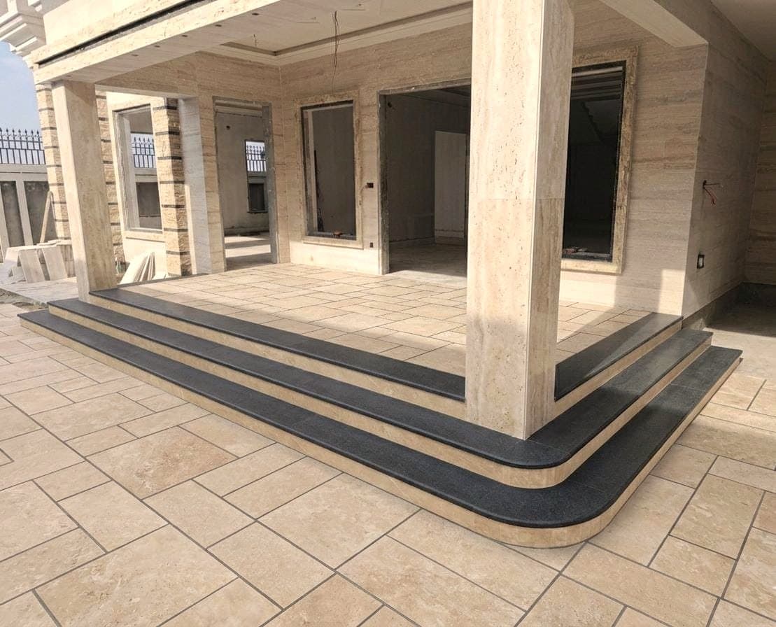 The same porch finished in travertine and black granite